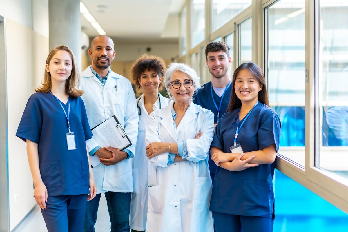 Portrait featuring a multi-ethnic medical team smiling confidently