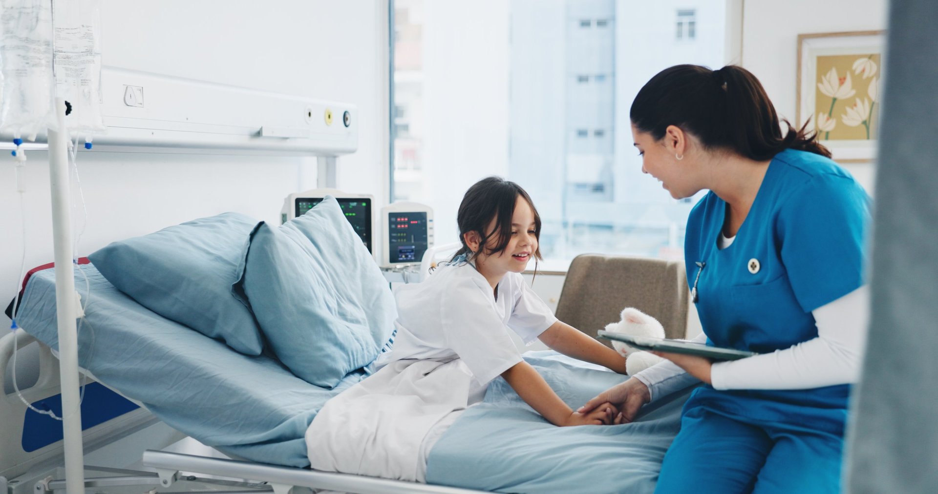 Nurse or doctor with child patient with tablet for health checkup or consultation